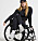 Lousie Linderoth sitter i sin rullstol i svarta träningskläder för Lindex kollektion