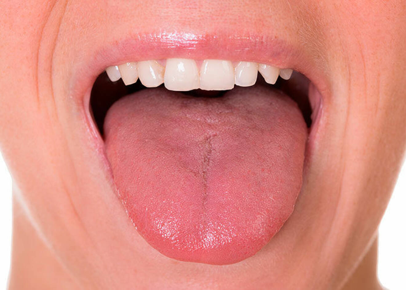 Kvinna med frisk fin rosa tunga