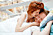 Couple in love hugging kissing in bed